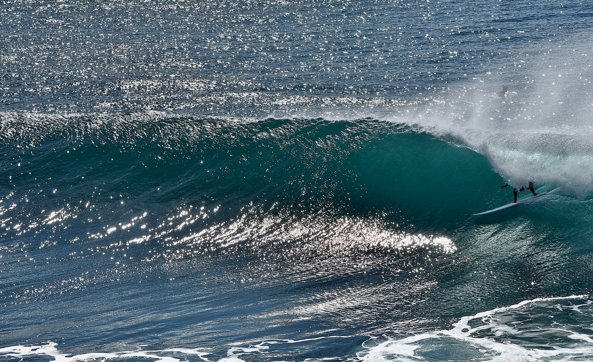 Surfer catching a wave in the ocean during a guided surf outing